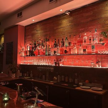 Season Six - a bar with bottles of alcohol on the wall - Salad Near Me - Toronto, Ontario Season Six - a bar with bottles of alcohol on the wall - Salad Near Me - Toronto, Ontario