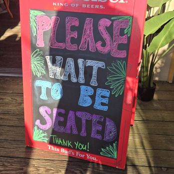 Tiki Bar At Sunset Harbour - Please wait to be seated sign. - Tiki Bars Near Me - East Patchogue, New York Tiki Bar At Sunset Harbour - Please wait to be seated sign. - Tiki Bars Near Me - East Patchogue, New York
