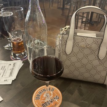 Unhinged Brewing - a glass of wine and a bottle - Coffee & Tea Near Me - Albuquerque, New Mexico