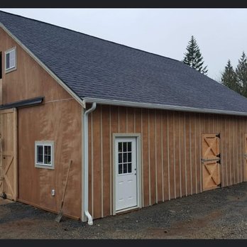 Sound to Summit Construction - Custom barn outside during build. Classic sliding barn doors, and dutch doors from each stall will be connected to horse run. - General Contractors Near Me Sound to Summit Construction - Custom barn outside during build. Classic sliding barn doors, and dutch doors from each stall will be connected to horse run. - General Contractors Near Me