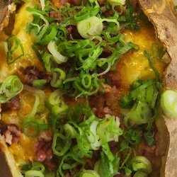 Spectacular Tubers - My plain Jane with extra chives, cheddar (sour cream comes in packets)
