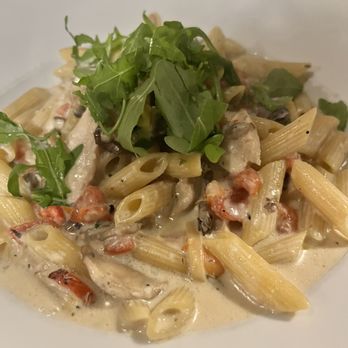 Portabello's - a pasta dish on a white plate - Pizza Near Me - Milton, Ontario