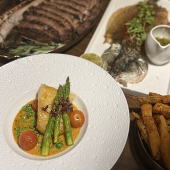 Blu Ember - Tomahawk steak grilled fish - New American Near Me - Queens, New York