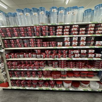 Dollar Tree - Display of red and clear plastic food storage containers on shelves at Dollar Tree, with labels and packaging visible. - Discount Store Near Me - Ventura, California