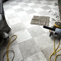 Limestone patio tiles - "Before" in foreground, "After" in background Limestone patio tiles - "Before" in foreground, "After" in background