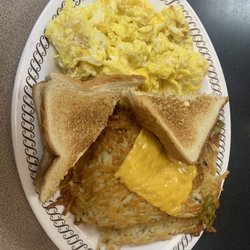 Waffle House - 2 egg plate (4 eggs, double hash browns peppered and smothered) and buttered toast