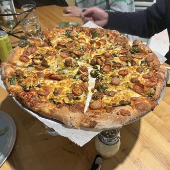 Iggies - pepperoni, spicy sausage, spinach, and caramelized onion pizza. - Pizza Near Me - Baltimore, Maryland