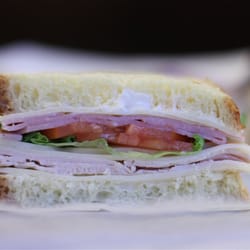 #4 North Lake Club. Turkey, ham, Swiss, lettuce, tomato, mayo on challah.