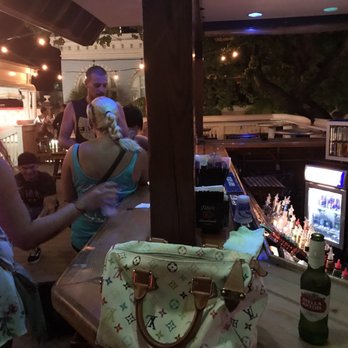 Rick's Mardi Gras - a woman sitting at a bar - Bars Near Me - Key West, Florida Rick's Mardi Gras - a woman sitting at a bar - Bars Near Me - Key West, Florida