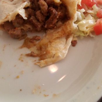 El Charro Mexican Grill - The filling of a burrito at El Charro. The meat was chopped a little small and just ok on flavor. Not much green chile in there. - Food Trucks Near Me - Las Cruces, New Mexico