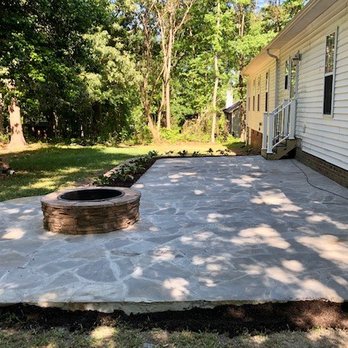 Otto's Landscaping & Lighting Contractors - a patio with a fire pit - General Contractors Near Me - Cinnaminson, New Jersey Otto's Landscaping & Lighting Contractors - a patio with a fire pit - General Contractors Near Me - Cinnaminson, New Jersey