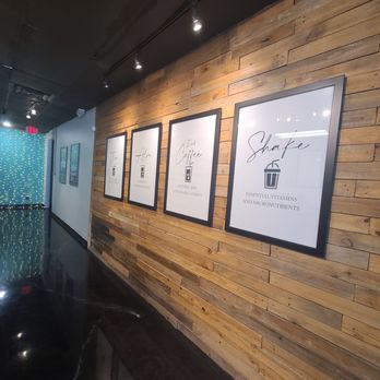 Nutrition With Attitude - a wood paneled wall and framed art - Juice Bars & Smoothies Near Me - Rowlett, Texas Nutrition With Attitude - a wood paneled wall and framed art - Juice Bars & Smoothies Near Me - Rowlett, Texas