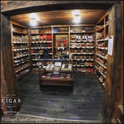 Village Cigar Company & Barbershop - Spend time in our massive, 2-room, walk-in humidor.