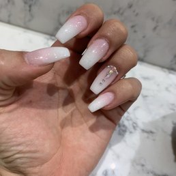 Jenny did an amazing job! Ombré acrylic set with bling and glitter on top. Jenny did an amazing job! Ombré acrylic set with bling and glitter on top.