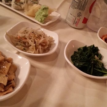 GOGI - Small plates of sides that came with our meal.  Cabbage, spinach, bean sprouts, tofu  and ? Maybe octopus? Lol - Sushi Bars Near Me - Chandler, Arizona