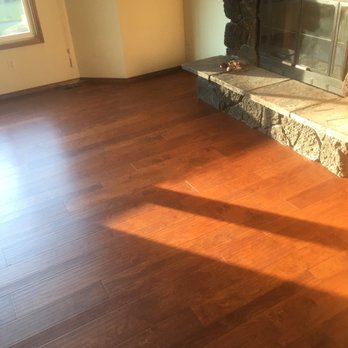 Unique Flooring - Living room by the stone fireplace - Flooring Near Me - Vancouver, Washington Unique Flooring - Living room by the stone fireplace - Flooring Near Me - Vancouver, Washington
