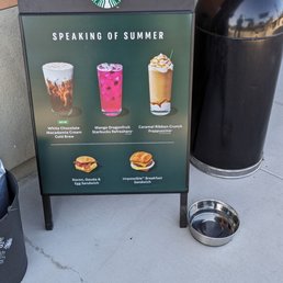 a sign with a variety of drinks a sign with a variety of drinks