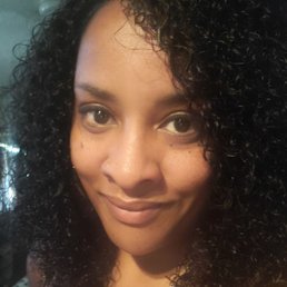 This is my favorite hairstyle done by Angie. It's so natural looking with a little of my edges out. Love love