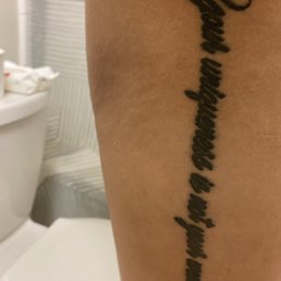 Tattoo, blown out and ink unevenly fading in some of the letters. Tattoo, blown out and ink unevenly fading in some of the letters.