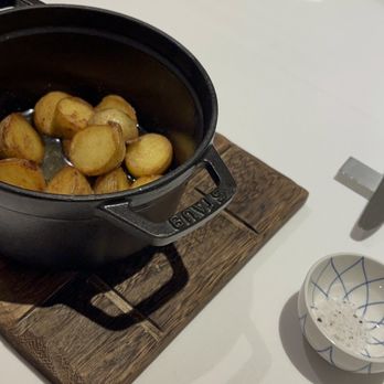 Margotto Hawaii - Baked Potato served in Brown Butter with Fresh Herbs in a hot pot - French Near Me - Honolulu, Hawaii Margotto Hawaii - Baked Potato served in Brown Butter with Fresh Herbs in a hot pot - French Near Me - Honolulu, Hawaii