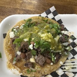Carne asada taco with green salsa