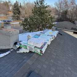 Advanced Construction Roofing - Roofing material and construction site.