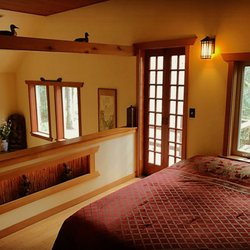 Zen River Retreat - The Loft in Cabin #1 has wonderful views of the surrounding forest, balcony, and plenty of natural light.