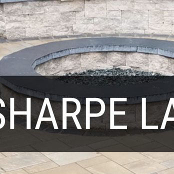 Looking Sharpe Landscapes - a fire pit in a backyard - Landscaping Near Me - Oakton, Virginia Looking Sharpe Landscapes - a fire pit in a backyard - Landscaping Near Me - Oakton, Virginia