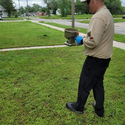 Dependable Pest Management - Granulating a yard to help with any flea, tick, ant, or cricket issues.
