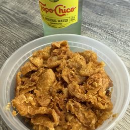 Crispy chicken skin and sparkling water Crispy chicken skin and sparkling water