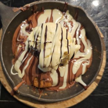 Melt N Dip - Hot, freshly- baked, chocolate chip cookie with a heavy pour of chocolate, topped with a single scoop of ice cream. Richie-rich! - Coffee & Tea Near Me - Fishers, Indiana