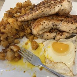 Breakfast souvlaki: home fries with onions, 2 sunny side up eggs and a lot of seasoned chicken.