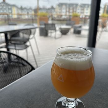 Triple Crossing Beer - Midlothian - a glass of beer on a table - Brewpubs Near Me - Midlothian, Virginia Triple Crossing Beer - Midlothian - a glass of beer on a table - Brewpubs Near Me - Midlothian, Virginia