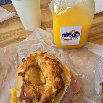 Eastside Bagel - Ham, egg and cheese on Sun dried tomato bagel with fresh squeezed orange juice - Delis Near Me - Saint Clair Shores, Michigan