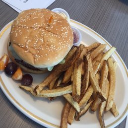 a hamburger and fries on a plate