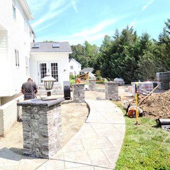 Dave’s Landscaping - a man working on a patio - Landscaping Near Me Dave’s Landscaping - a man working on a patio - Landscaping Near Me