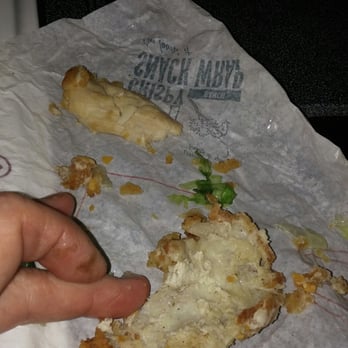 McDonald's - a hand holding a half eaten sandwich - Coffee & Tea Near Me - Cumming, Georgia McDonald's - a hand holding a half eaten sandwich - Coffee & Tea Near Me - Cumming, Georgia