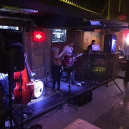 Dive NQ - Anna Sin playing in the band area - interior - Dive Bars Near Me - Manchester, XGM