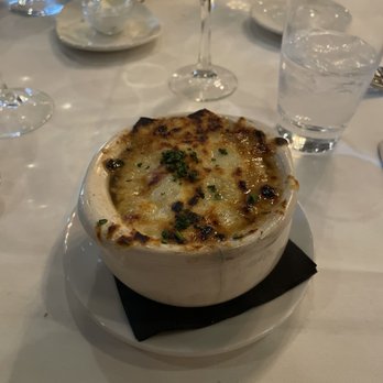Sullivan's Steakhouse - French Onion Soup; the broth underneath that heavenly layer of melted Gruyère cheese was phenomenal. - Steakhouses Near Me - Anchorage, Alaska Sullivan's Steakhouse - French Onion Soup; the broth underneath that heavenly layer of melted Gruyère cheese was phenomenal. - Steakhouses Near Me - Anchorage, Alaska