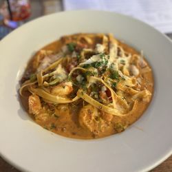 Alhambra Irish House - Vodka fettuccine with shrimp and sausage (instead of the chicken--the chicken is so bland). This is elite