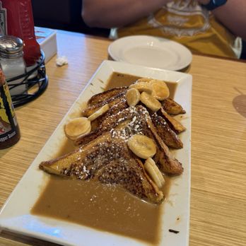 Canoe House - BANANA KAHLUA FRENCH TOAST (V) Kahlua liqueur | sautéed bananas | powdered sugar | butter - Hawaiian Near Me - South Pasadena, California Canoe House - BANANA KAHLUA FRENCH TOAST (V) Kahlua liqueur | sautéed bananas | powdered sugar | butter - Hawaiian Near Me - South Pasadena, California