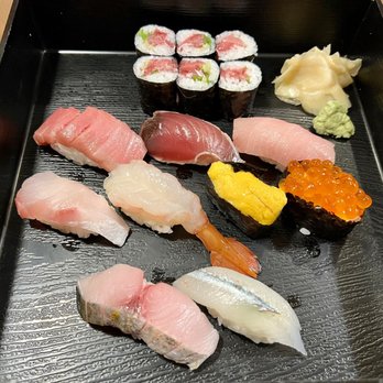 Sharaku - a variety of sushi on a black tray - Sushi Bars Near Me - West Bloomfield, Michigan Sharaku - a variety of sushi on a black tray - Sushi Bars Near Me - West Bloomfield, Michigan