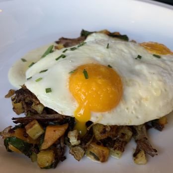 Honeypie Cafe - Brisket hash after yolk cracked itself - New American Near Me - Milwaukee, Wisconsin Honeypie Cafe - Brisket hash after yolk cracked itself - New American Near Me - Milwaukee, Wisconsin