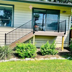 Austex Fence & Deck - Small composite patio with iron railing