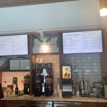 Cornucopia Gourmet Market - a man sitting at a counter - Coffee & Tea Near Me - Fort Lauderdale, Florida