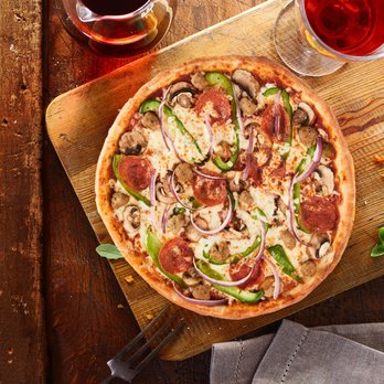 Freshslice Pizza - a pizza on a cutting board - Pizza Near Me - Vancouver, British Columbia