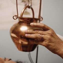 Beyond Holistic Center - Shirodhara is a form of therapy in Ayurveda.