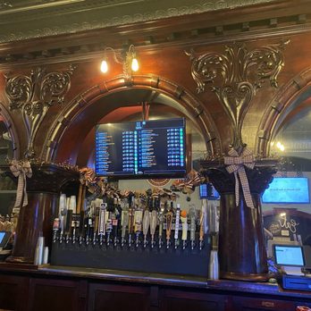 TAP21 - Great woodwork on the bar. You can see a glimpse of the stamped tin ceiling. - Beer Bar Near Me - Manistique, Michigan TAP21 - Great woodwork on the bar. You can see a glimpse of the stamped tin ceiling. - Beer Bar Near Me - Manistique, Michigan