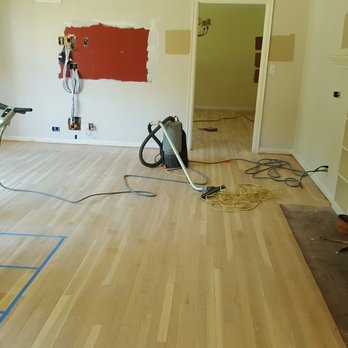 All About Wood - a man working on a hardwood floor - Flooring Near Me - Los Angeles, California All About Wood - a man working on a hardwood floor - Flooring Near Me - Los Angeles, California