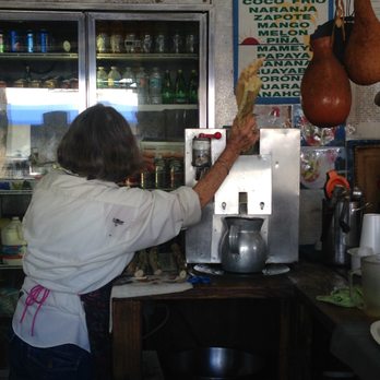 Miami Culinary Tours - Making fresh Guarapo (Sugar Cane) juice at Los Pinarenos Fruteria. - Food Tours Near Me - Miami Beach, Florida Miami Culinary Tours - Making fresh Guarapo (Sugar Cane) juice at Los Pinarenos Fruteria. - Food Tours Near Me - Miami Beach, Florida